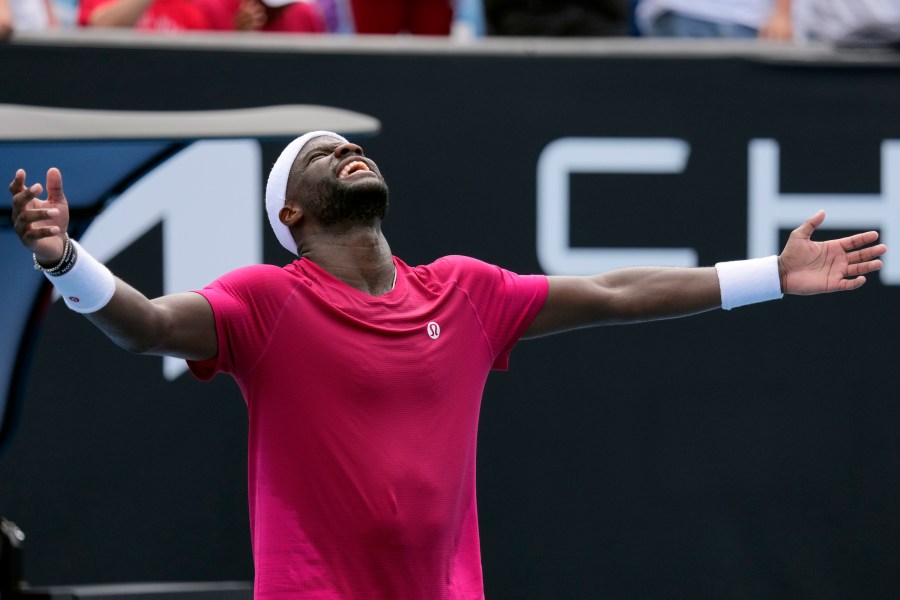 Frances Tiafoe of the U.S. celebrates after defeating Arthur Rinderknech of France in their first round match at the Australian Open tennis championship in Melbourne, Australia, Monday, Jan. 13, 2025. (AP Photo/Vincent Thian)