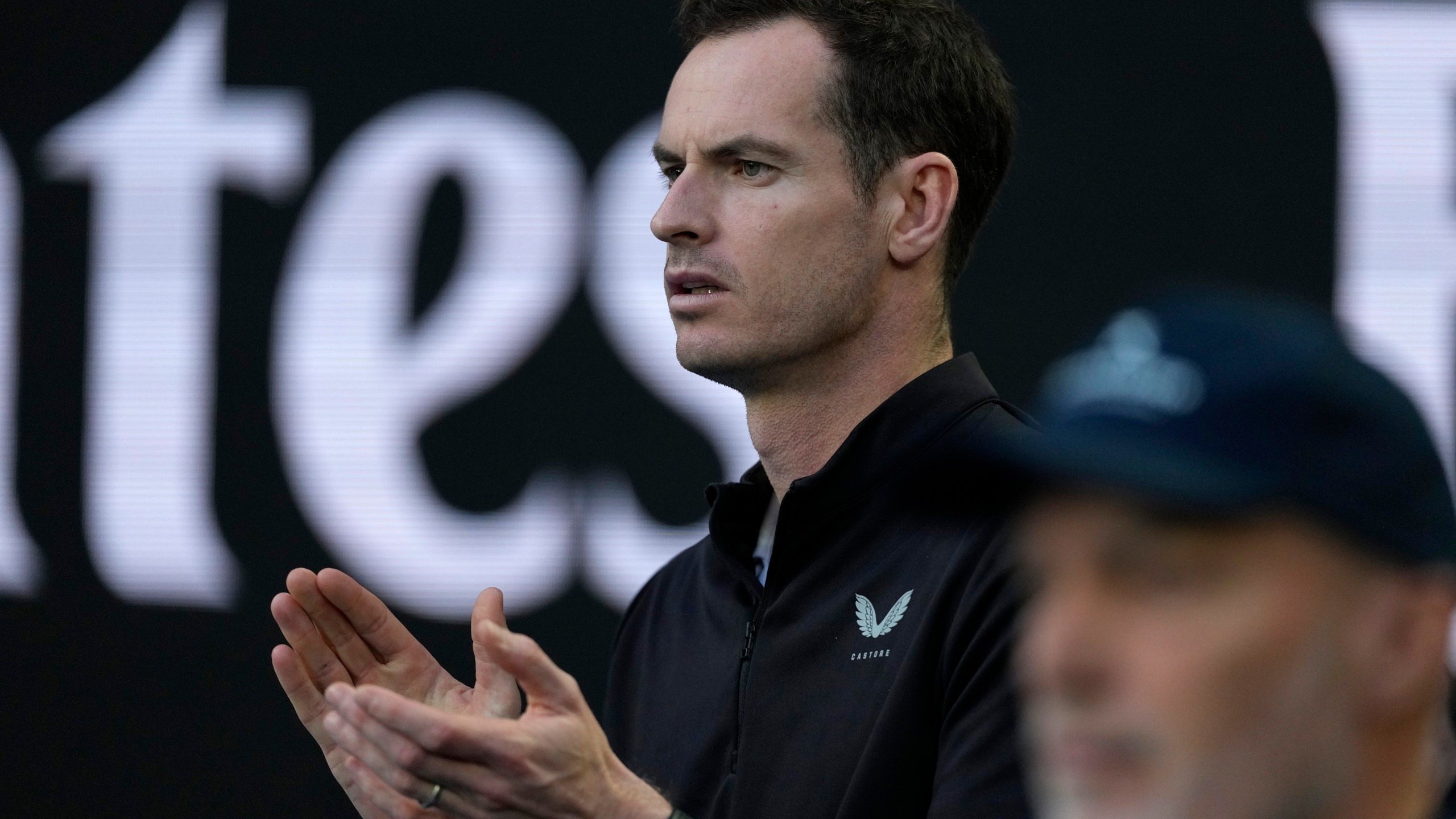 Andy Murray, coach of Novak Djokovic of Serbia watches his first round match against Nishesh Basavareddy of the U.S. at the Australian Open tennis championship in Melbourne, Australia, Monday, Jan. 13, 2025. (AP Photo/Asanka Brendon Ratnayake)