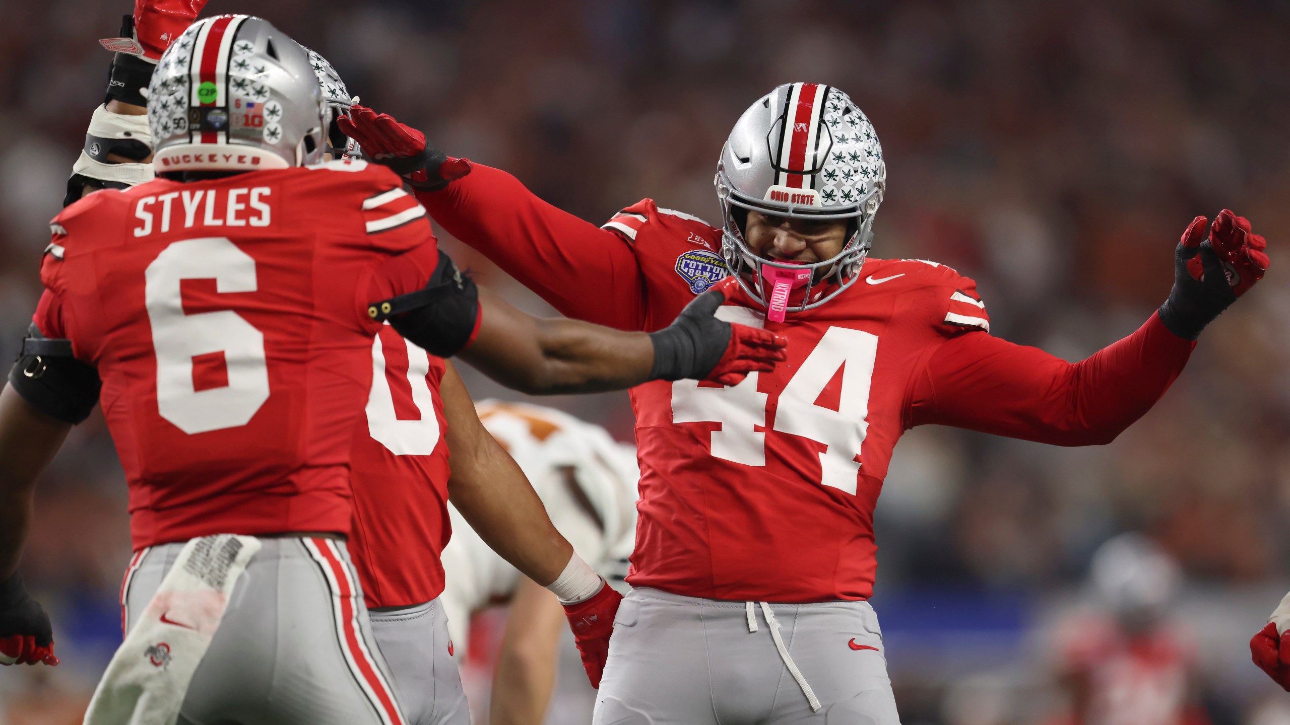 Ohio State safety Sonny Styles (6) celebrates with defensive end JT Tuimoloau (44) during the first half of the Cotton Bowl College Football Playoff semifinal game against Texas, Friday, Jan. 10, 2025, in Arlington, Texas. (AP Photo/Gareth Patterson)