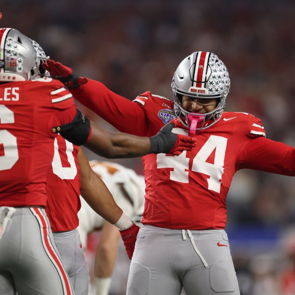 Ohio State safety Sonny Styles (6) celebrates with defensive end JT Tuimoloau (44) during the first half of the Cotton Bowl College Football Playoff semifinal game against Texas, Friday, Jan. 10, 2025, in Arlington, Texas. (AP Photo/Gareth Patterson)