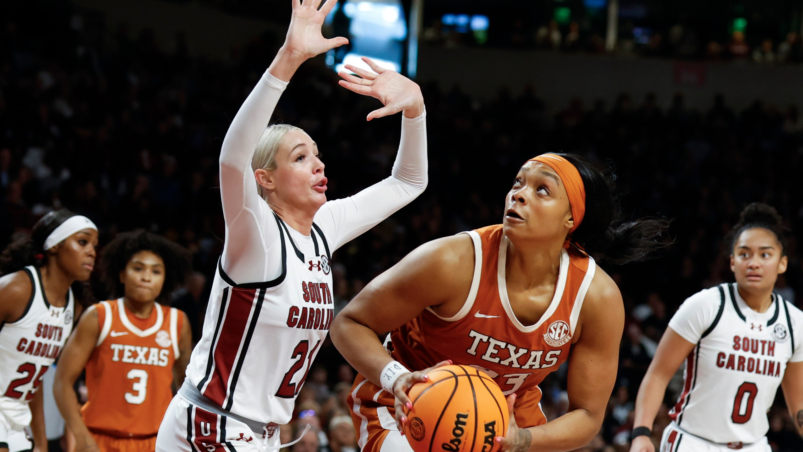 Texas forward Aaliyah Moore looks to shoot against South Carolina forward Chloe Kitts (21) during the second half of an NCAA college basketball game in Columbia, S.C., Sunday, Jan. 12, 2025. (AP Photo/Nell Redmond)