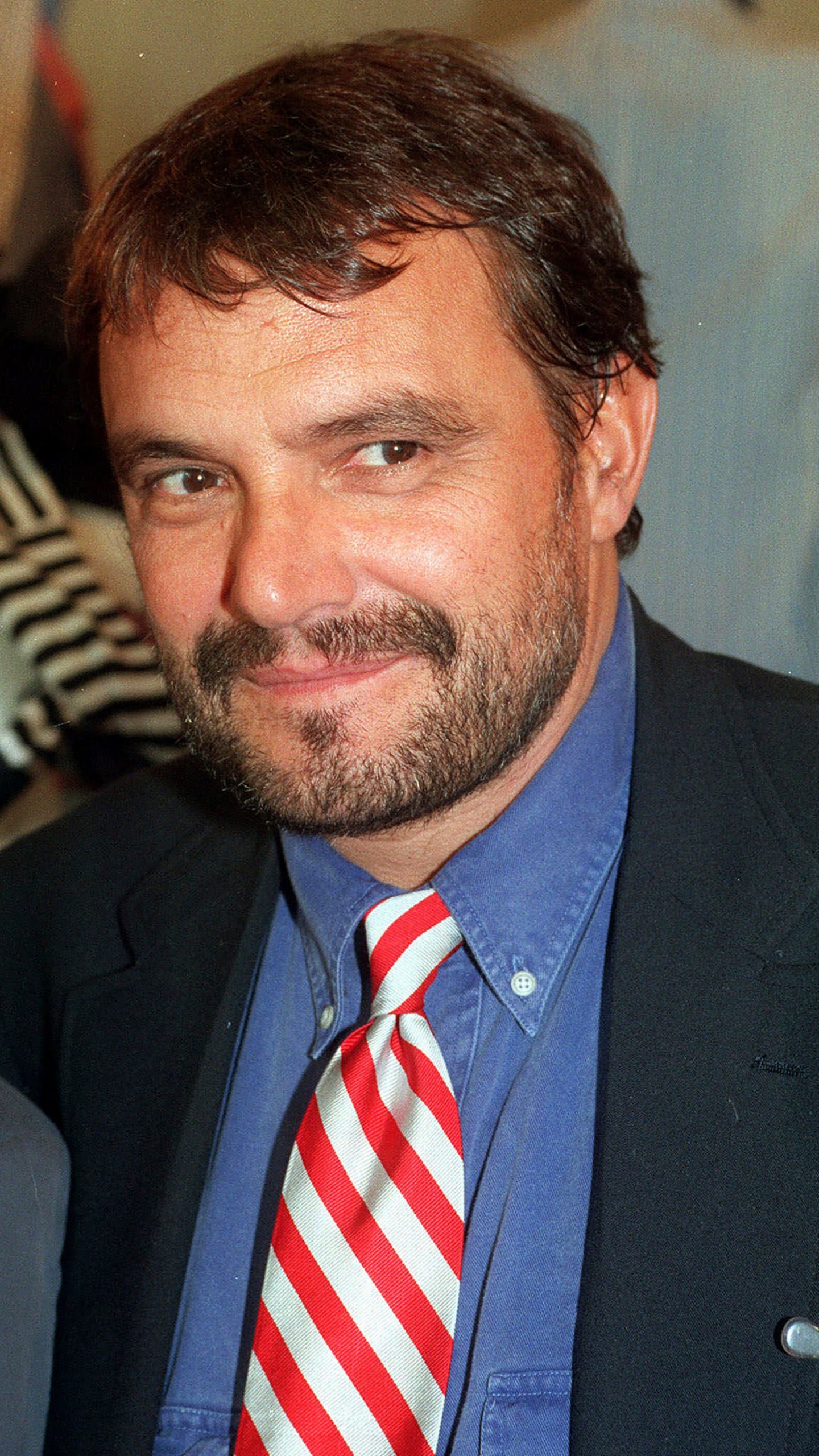 FILE - Benetton creative director and photographer Oliviero Toscani smiles in this 1993 file photo taken in Milan, Italy. (AP Photo/Luca Bruno, File)