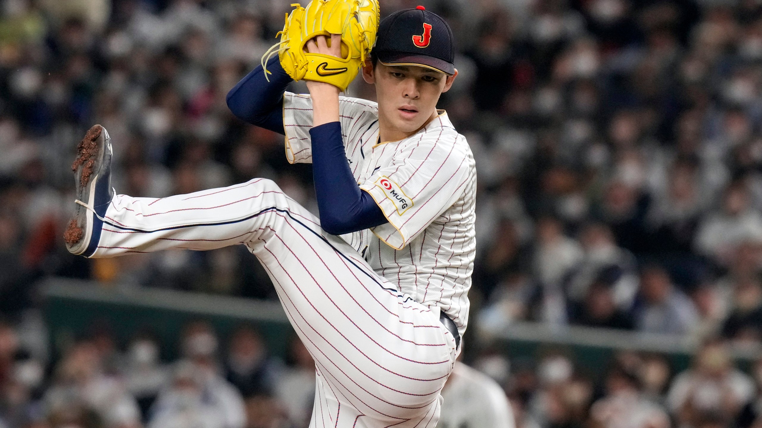 FILE - Roki Sasaki, of Japan, pitches during their Pool B game against the Czech Republic at the World Baseball Classic at the Tokyo Dome in Japan Saturday, March 11, 2023. (AP Photo/Eugene Hoshiko, File)