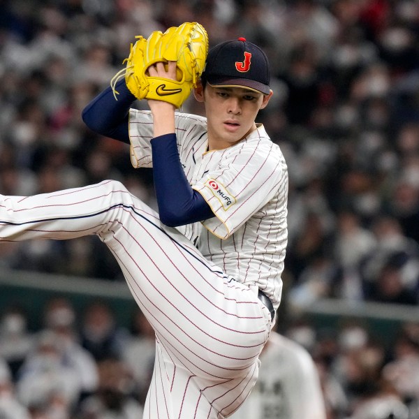 FILE - Roki Sasaki, of Japan, pitches during their Pool B game against the Czech Republic at the World Baseball Classic at the Tokyo Dome in Japan Saturday, March 11, 2023. (AP Photo/Eugene Hoshiko, File)