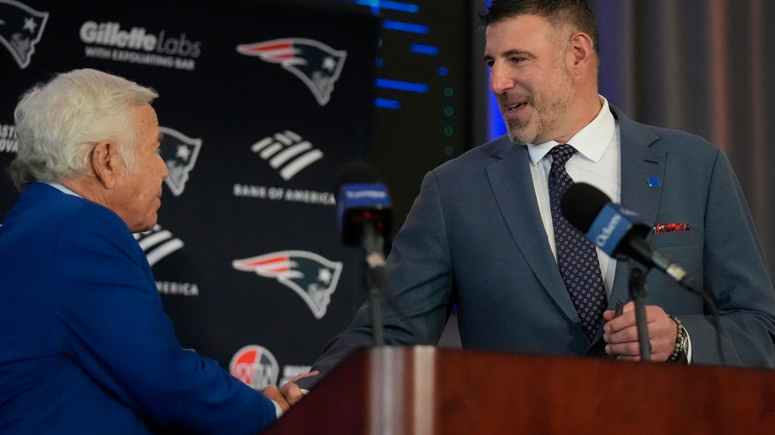 New England Patriots head coach Mike Vrabel, right, shakes hands with team owner Robert Kraft while being introduced during an availability, Monday, Jan. 13, 2025, in Foxborough, Mass. (AP Photo/Charles Krupa)