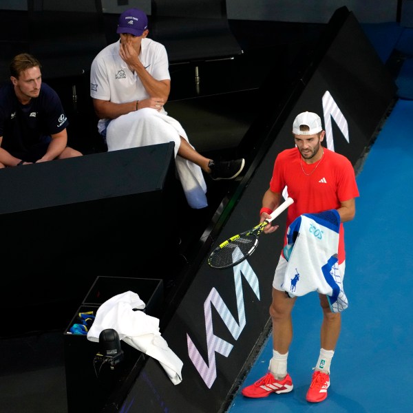 Jacob Fearnley of Britain stands by his coaches box during their first round match against Nick Kyrgios of Australia at the Australian Open tennis championship in Melbourne, Australia, Monday, Jan. 13, 2025. (AP Photo/Ng Han Guan)