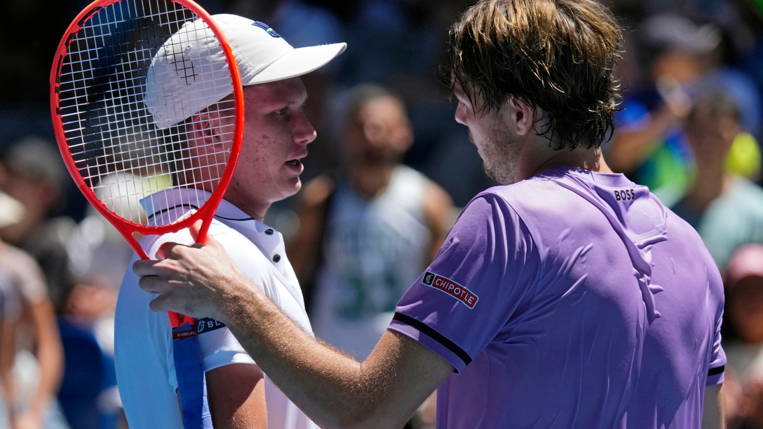 Taylor Fritz, right, of the U.S. is congratulated by compatriot Jenson Brooksby following their first round match at the Australian Open tennis championship in Melbourne, Australia, Tuesday, Jan. 14, 2025. (AP Photo/Vincent Thian)