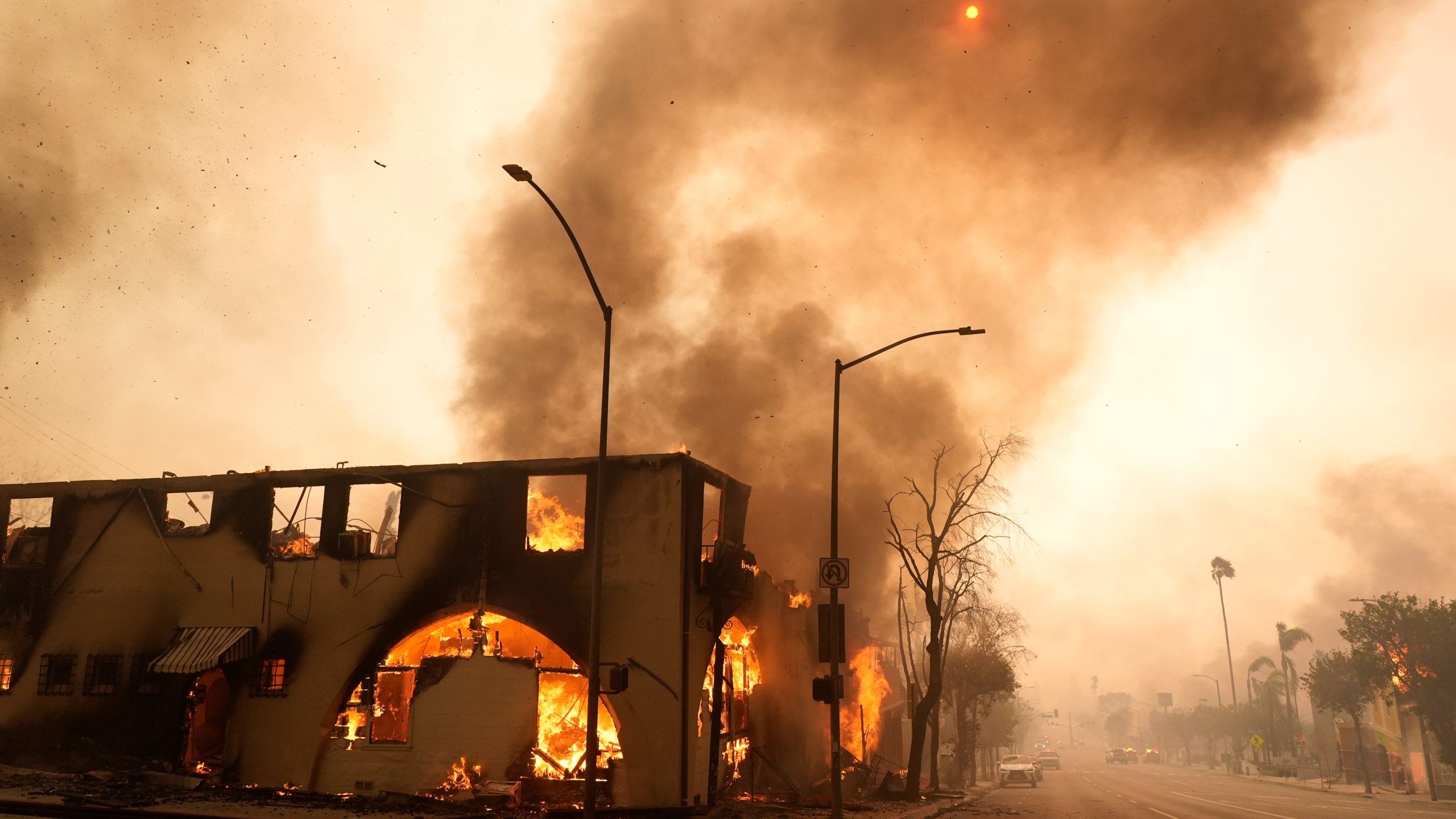 FILE - A structure on Lake Avenue is engulfed in flames, Jan. 8, 2025, in the Altadena section of Pasadena, Calif. (AP Photo/Chris Pizzello, File)