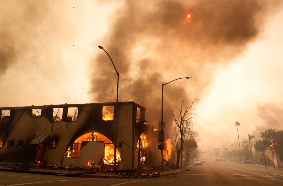 FILE - A structure on Lake Avenue is engulfed in flames, Jan. 8, 2025, in the Altadena section of Pasadena, Calif. (AP Photo/Chris Pizzello, File)