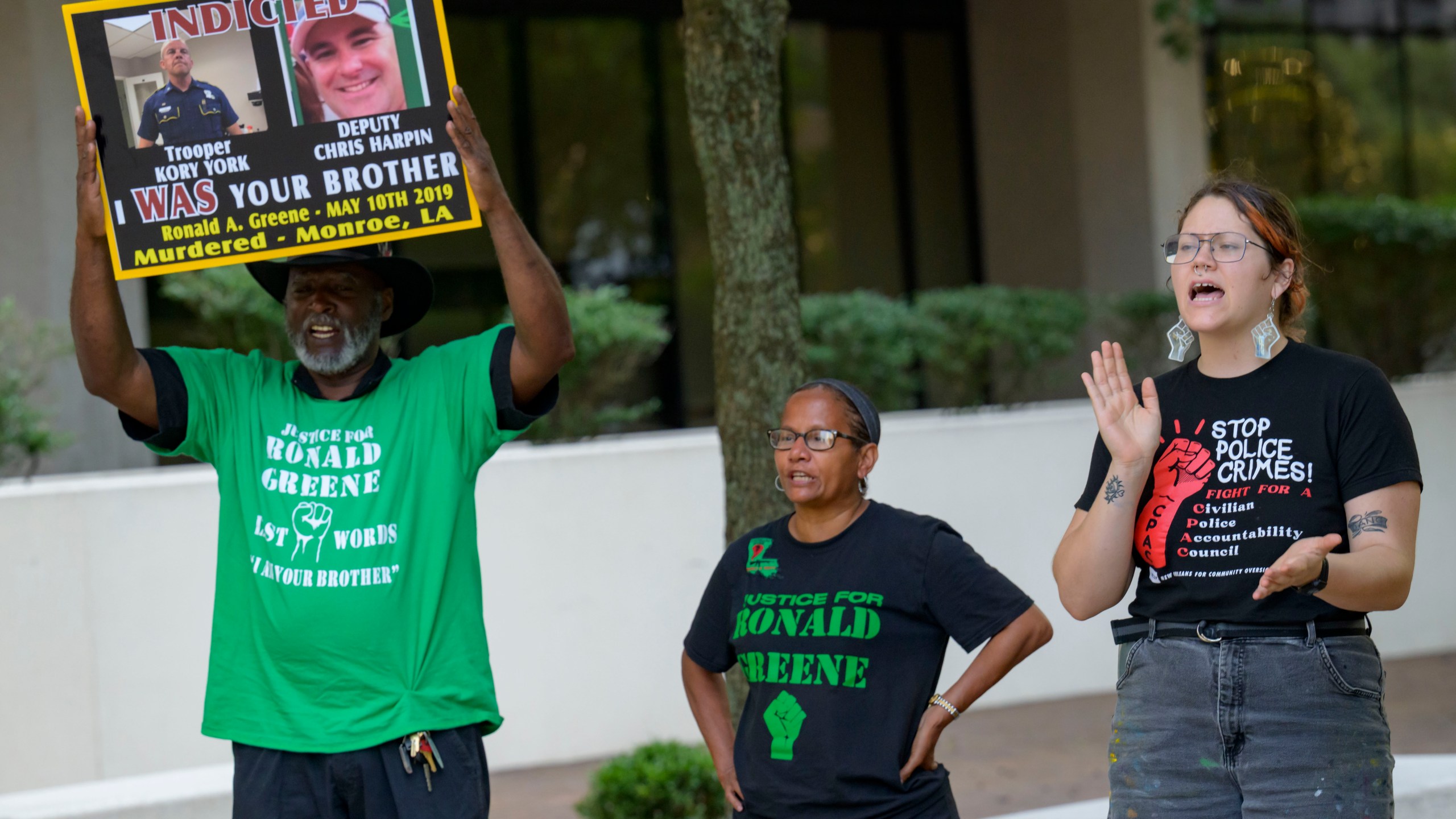 FILE - From left, Lumumba Lutalo, Angela "Mama Ghost" Green and Antonia Mar, of New Orleans for Community Oversight of Police, take part in a rally for justice for Ronald Greene at the Eastern District of Louisiana Courthouse in New Orleans, on May 10, 2024. (AP Photo/Matthew Hinton, File)