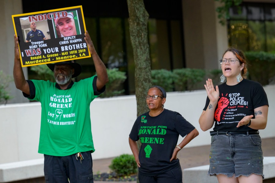 FILE - From left, Lumumba Lutalo, Angela "Mama Ghost" Green and Antonia Mar, of New Orleans for Community Oversight of Police, take part in a rally for justice for Ronald Greene at the Eastern District of Louisiana Courthouse in New Orleans, on May 10, 2024. (AP Photo/Matthew Hinton, File)