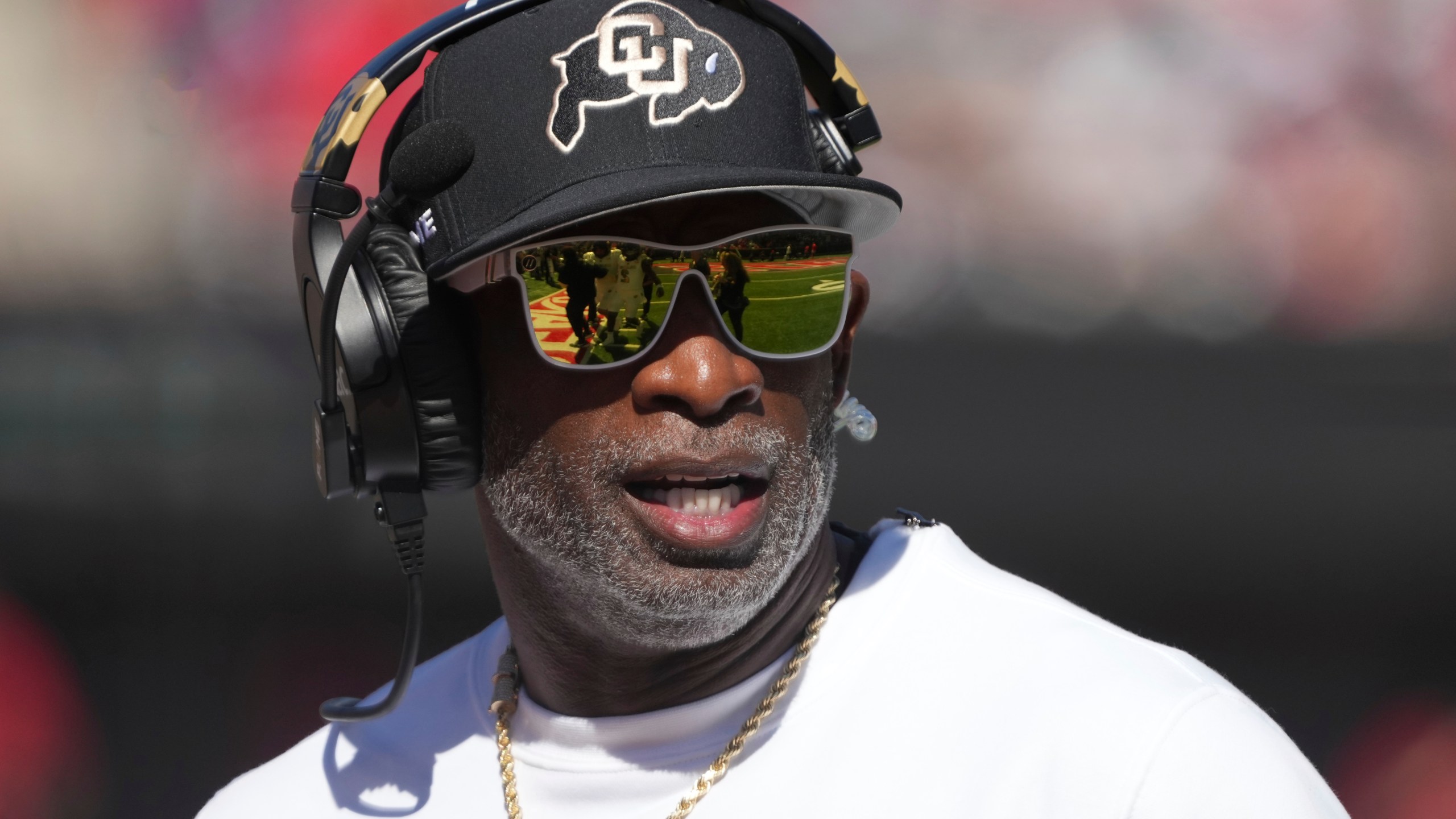 FILE - Colorado head coach Deion Sanders watches the replay in the first half during an NCAA college football game against Arizona, Oct. 19, 2024, in Tucson, Ariz. (AP Photo/Rick Scuteri, file)