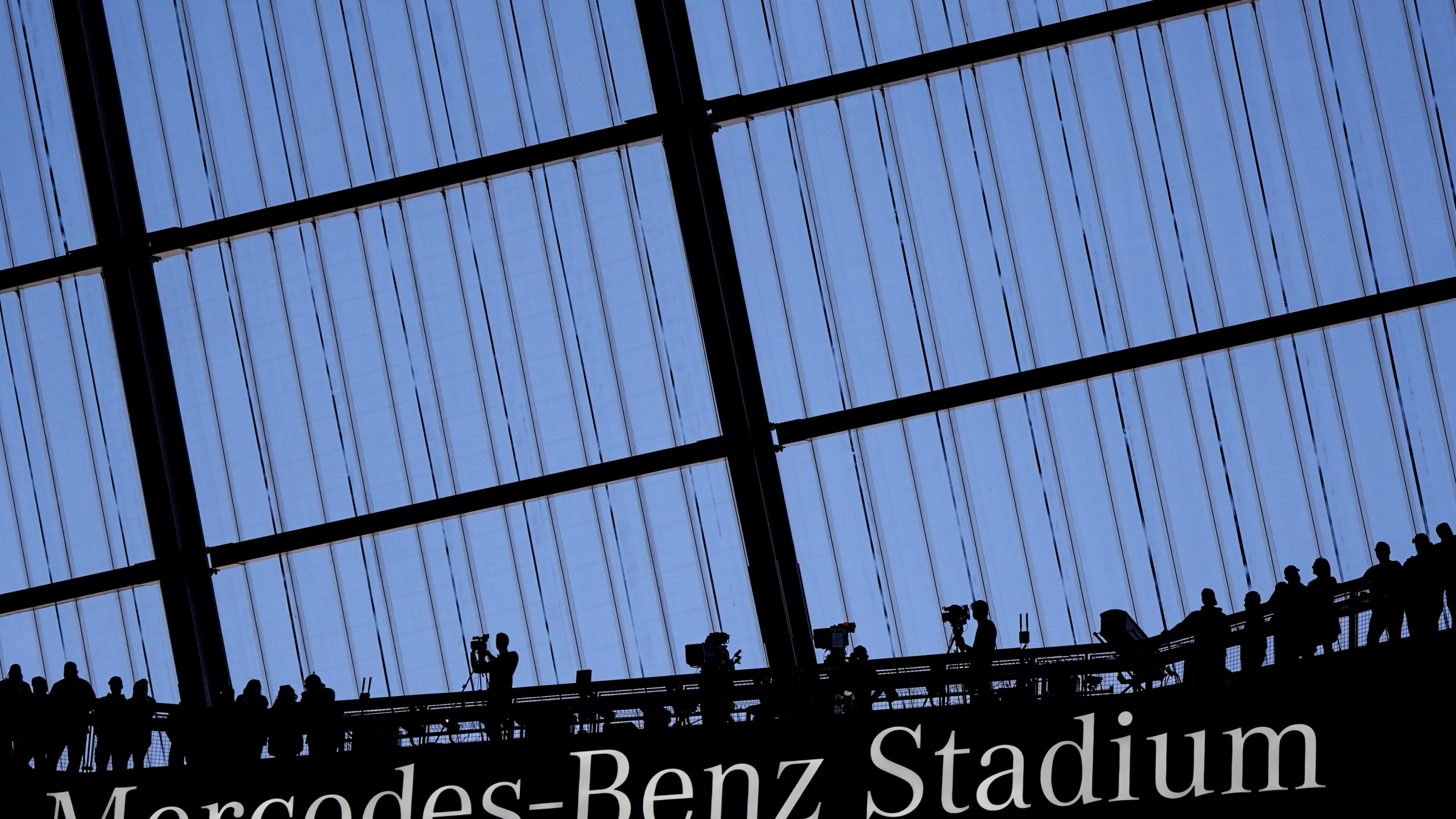 FILE - Fans watch an NFL football game at the Mercedes-Benz Stadium in Atlanta, Dec. 1, 2024. (AP Photo/Mike Stewart, File)