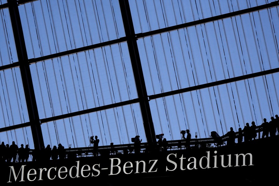 FILE - Fans watch an NFL football game at the Mercedes-Benz Stadium in Atlanta, Dec. 1, 2024. (AP Photo/Mike Stewart, File)