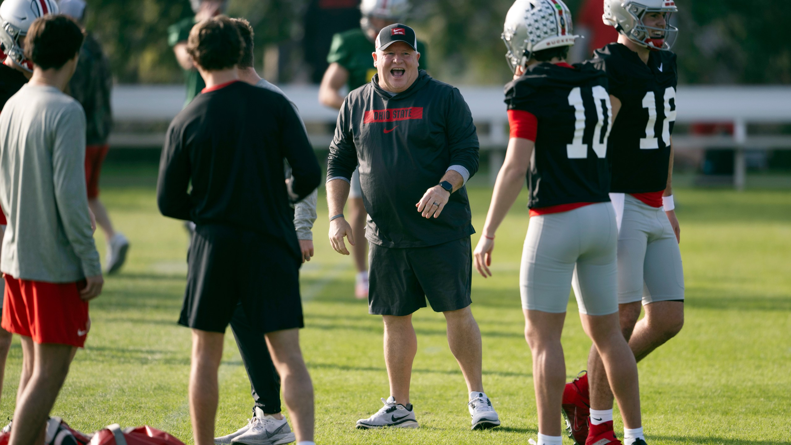 FILE - Ohio State offensive coordinator Chip Kelly laughs during practice in Carson, Calif., Monday, Dec. 30, 2024, ahead of Rose Bowl College Football Playoff game against Oregon. (AP Photo/Kyusung Gong, File)