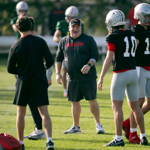 FILE - Ohio State offensive coordinator Chip Kelly laughs during practice in Carson, Calif., Monday, Dec. 30, 2024, ahead of Rose Bowl College Football Playoff game against Oregon. (AP Photo/Kyusung Gong, File)