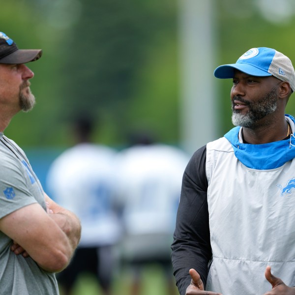 FILE - Detroit Lions head coach Dan Campbell, left, and general manager Brad Holmes, right, talk after an NFL football practice in Allen Park, Mich., June 6, 2023. (AP Photo/Paul Sancya, file)