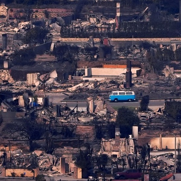 A VW van sits among burned out homes, Jan. 9, 2025, in Malibu, Calif. (AP Photo/Mark J. Terrill)