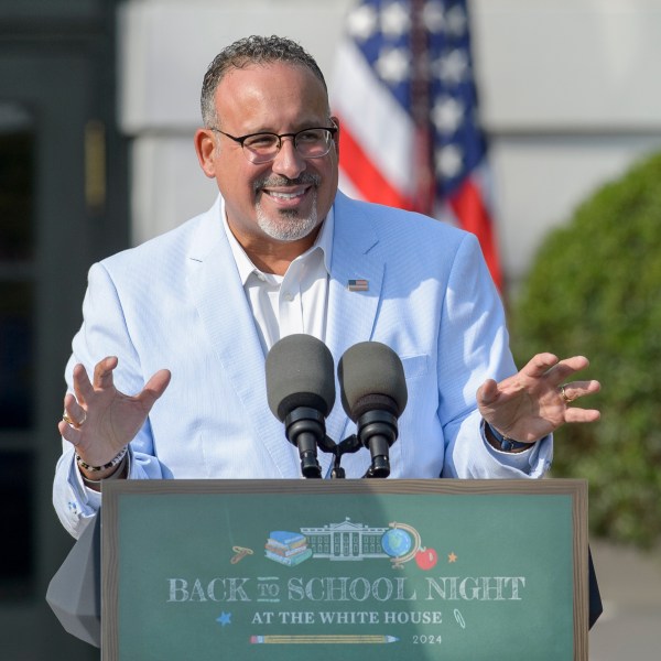 FILE - U.S. Secretary of Education Miguel Cardona offers remarks at the first-ever Back-to-School Night at the White House on the South Lawn of the White House in Washington, Sept. 21, 2024. (AP Photo/Rod Lamkey, Jr., File)