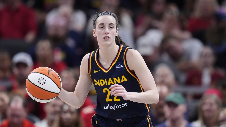 FILE - Indiana Fever guard Caitlin Clark (22) plays against the Dallas Wings in the second half of a WNBA basketball game in Indianapolis, Sept. 15, 2024. (AP Photo/Michael Conroy, File)