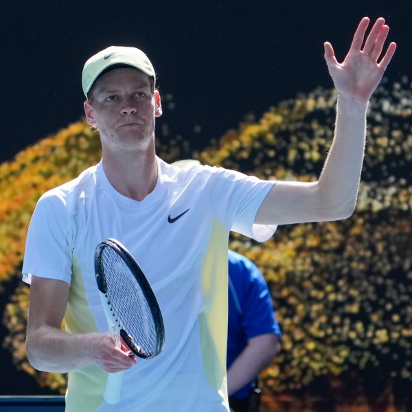 Jannik Sinner of Italy waves after defeating Nicolas Jarry of Chile in their first round match at the Australian Open tennis championship in Melbourne, Australia, Monday, Jan. 13, 2025. (AP Photo/Asanka Brendon Ratnayake)