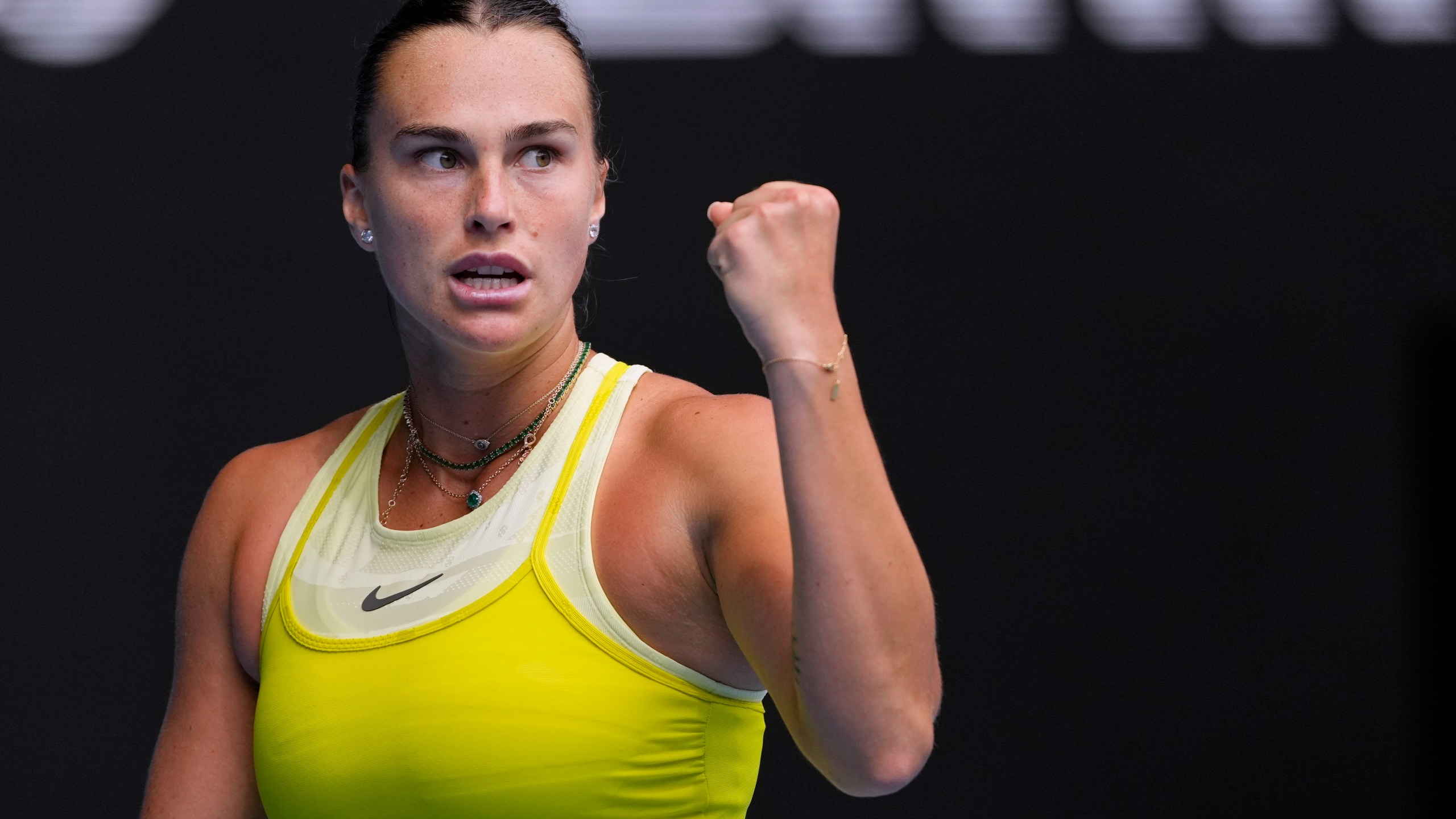 Aryna Sabalenka of Belarus reacts after winning a point against Jessica Bouzas Maneiro of Spain during their second round match at the Australian Open tennis championship in Melbourne, Australia, Wednesday, Jan. 15, 2025. (AP Photo/Vincent Thian)