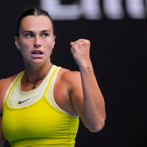 Aryna Sabalenka of Belarus reacts after winning a point against Jessica Bouzas Maneiro of Spain during their second round match at the Australian Open tennis championship in Melbourne, Australia, Wednesday, Jan. 15, 2025. (AP Photo/Vincent Thian)