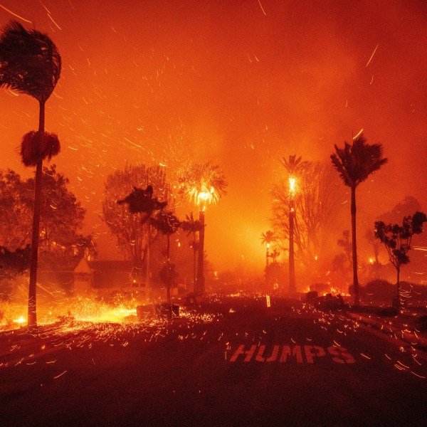 The Palisades Fire ravages a neighborhood amid high winds in the Pacific Palisades neighborhood of Los Angeles, Jan. 7, 2025. (AP Photo/Ethan Swope)