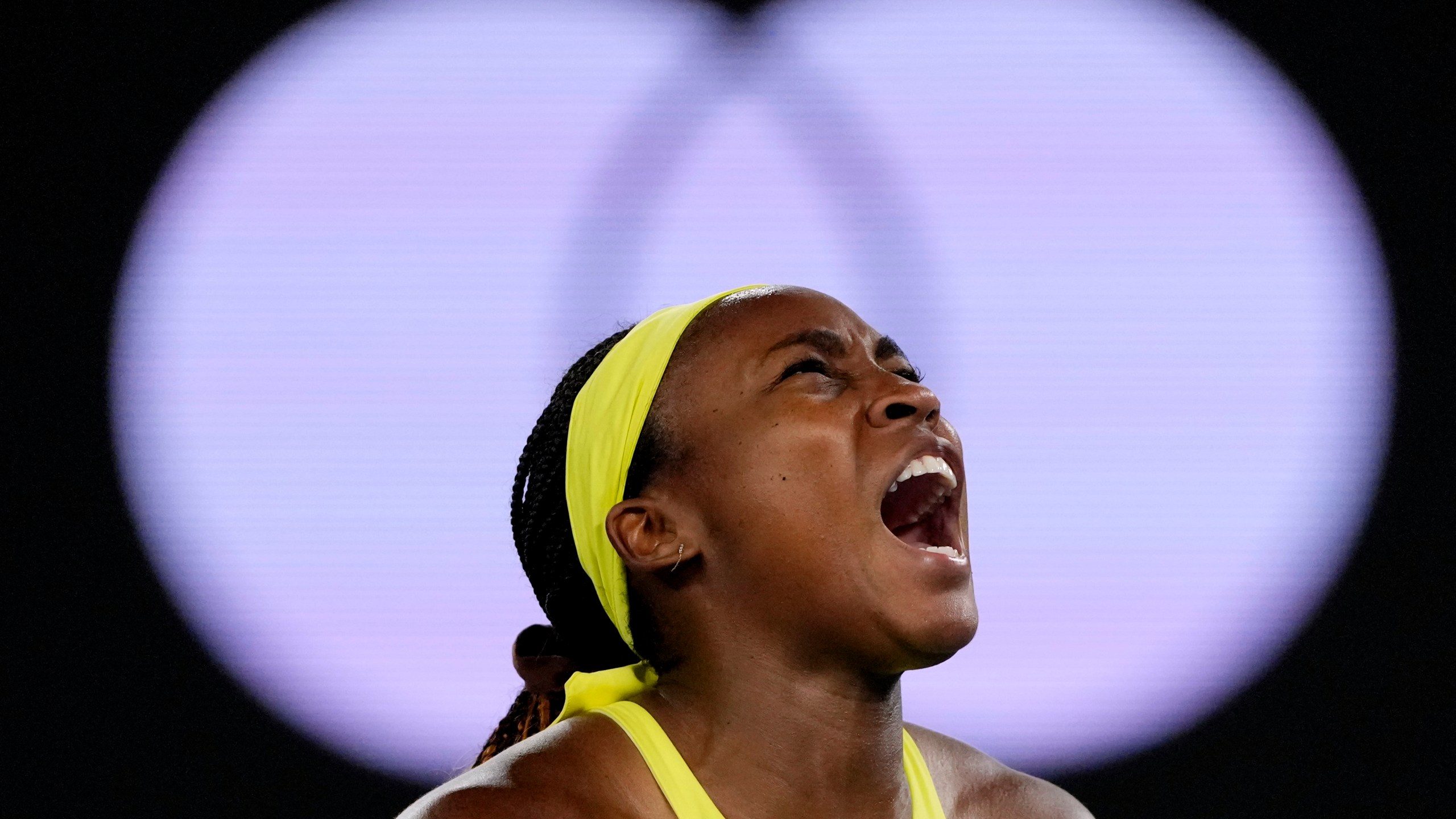 Coco Gauff of the U.S. reacts after winning a point against Jodie Burrage of Britain during their second round match at the Australian Open tennis championship in Melbourne, Australia, Wednesday, Jan. 15, 2025. (AP Photo/Vincent Thian)