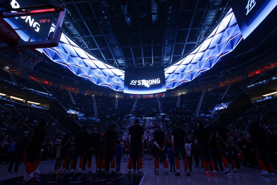 Los Angeles Clippers players stand during a moment of silence for victims of the ongoing California wildfires before an NBA basketball game against the Miami Heat, Monday, Jan. 13, 2025, in Los Angeles. (AP Photo/Jessie Alcheh)