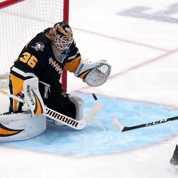 Pittsburgh Penguins goaltender Tristan Jarry blocks a shot by Seattle Kraken's Jared McCann during the first period of an NHL hockey game in Pittsburgh, Tuesday, Jan. 14, 2025. (AP Photo/Gene J. Puskar)