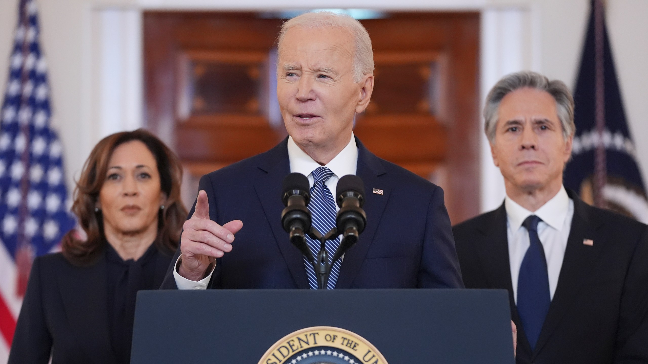 President Joe Biden, center, with Vice President Kamala Harris, left, and Sec. of State Anthony Blinken, right, speaks in the Cross Hall of the White House on the announcement of a ceasefire deal in Gaza and the release of dozens of hostages after more than 15 months of war, Wednesday, Jan. 15, 2025, in Washington. (AP Photo/Evan Vucci)