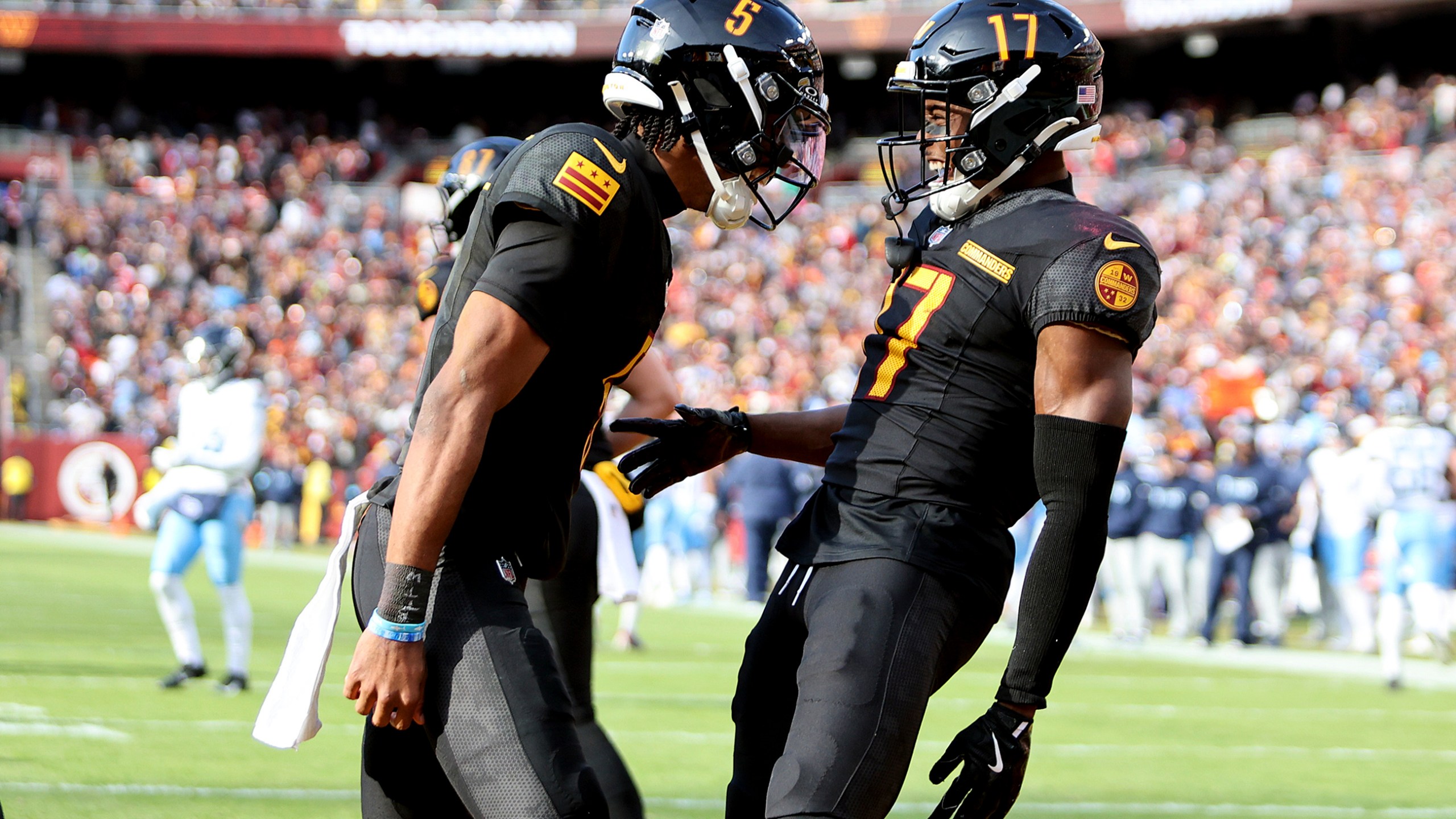 FILE - Washington Commanders quarterback Jayden Daniels (5) celebrates with Washington Commanders wide receiver Terry McLaurin (17) during an NFL football game against the Tennessee Titans, Dec. 1, 2024 in Landover, Md. (AP Photo/Daniel Kucin Jr., File)