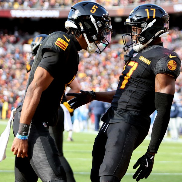 FILE - Washington Commanders quarterback Jayden Daniels (5) celebrates with Washington Commanders wide receiver Terry McLaurin (17) during an NFL football game against the Tennessee Titans, Dec. 1, 2024 in Landover, Md. (AP Photo/Daniel Kucin Jr., File)