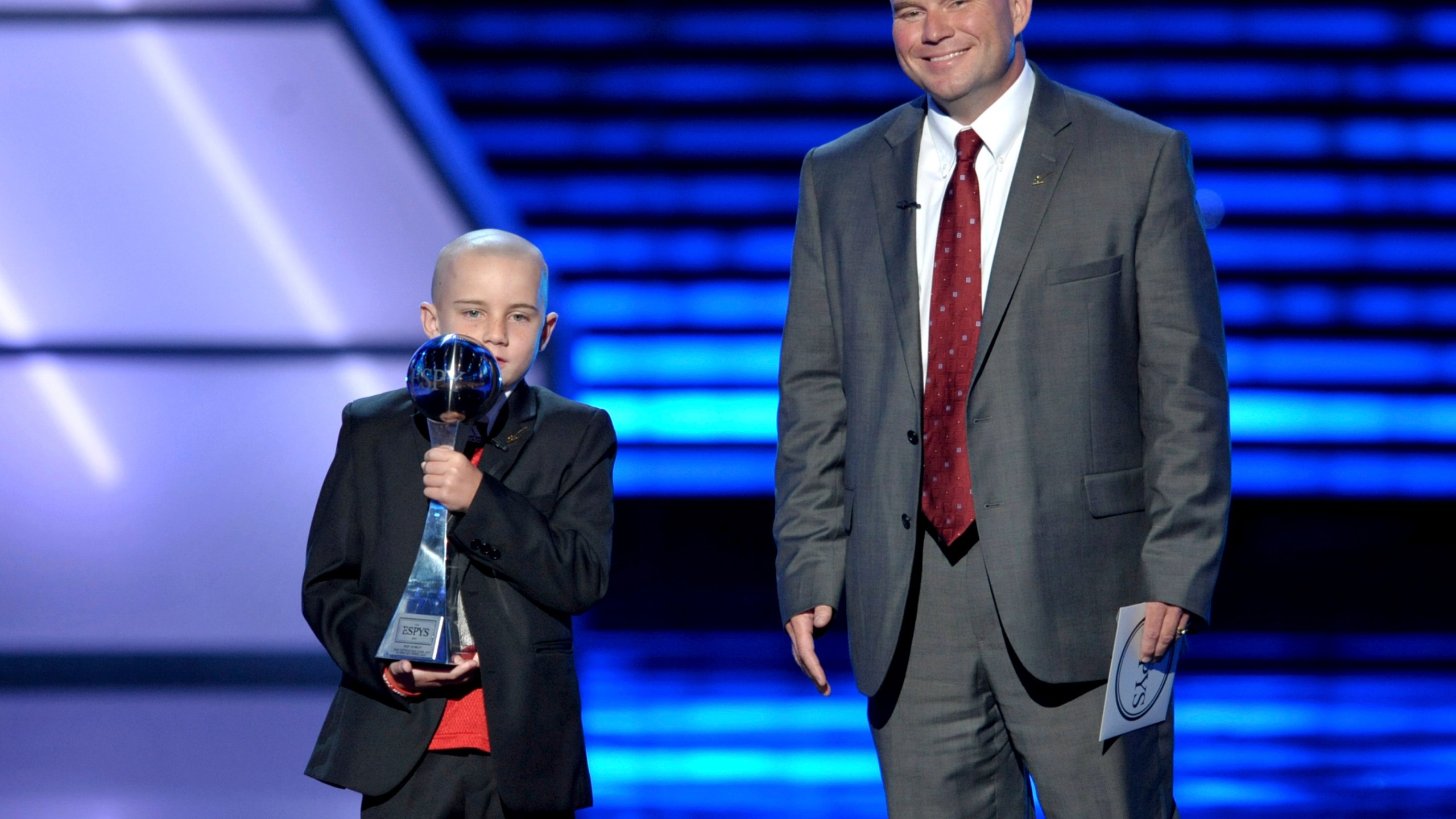 FILE - Jack Hoffman, left, accepts the award for best moment at the ESPY Awards, July 17, 2013, at Nokia Theater in Los Angeles. At right is Andy Hoffman. (Photo by John Shearer/Invision/AP, File)