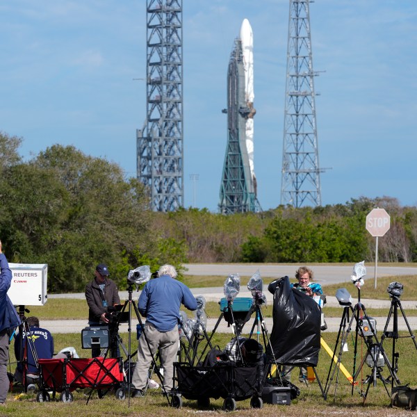 Photographers reset their remote cameras for yet another launch attempt of Blue Origin's New Glenn rocket from Launch Complex 36 at the Cape Canaveral Space Force Station, Wednesday, Jan. 15, 2025, in Cape Canaveral, Fla. (AP Photo/John Raoux)