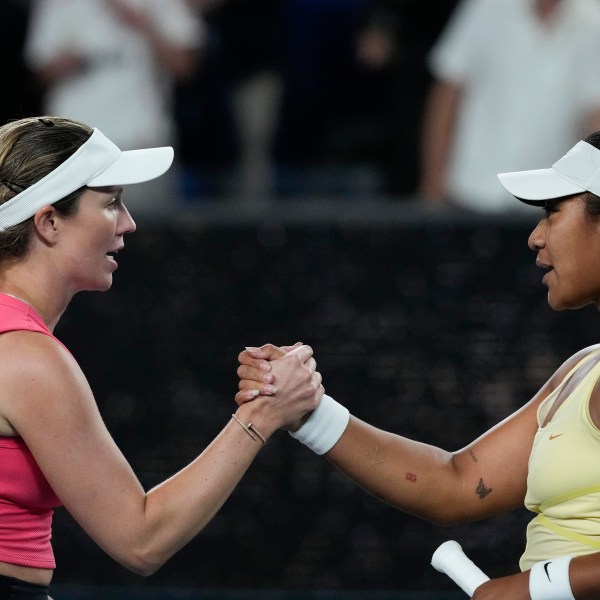 Danielle Collins, left, of the U.S. is congratulated by Destanee Aiava of Australia following their second round match at the Australian Open tennis championship in Melbourne, Australia, Thursday, Jan. 16, 2025. (AP Photo/Manish Swarup)