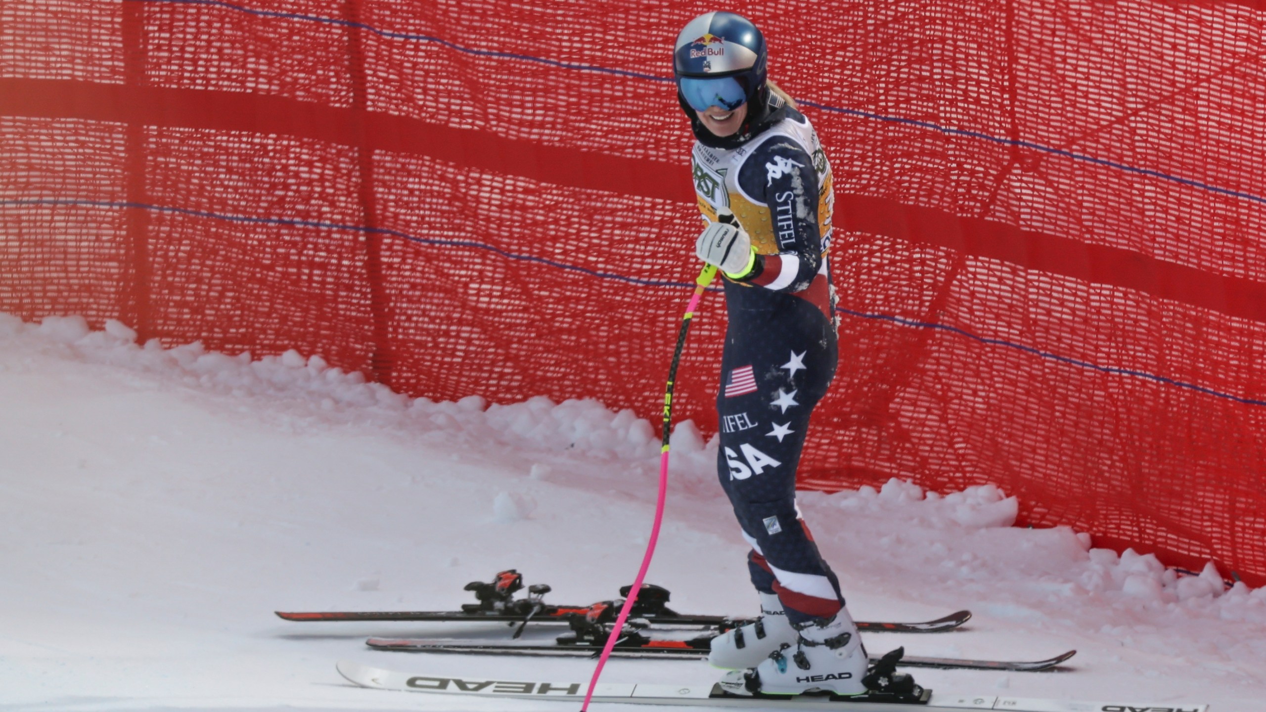 United States' Lindsey Vonn reacts after crashing during an alpine ski, women's World Cup downhill training, in Cortina d'Ampezzo, Italy, Thursday, Jan. 16, 2025. (AP Photo/Marco Trovati)