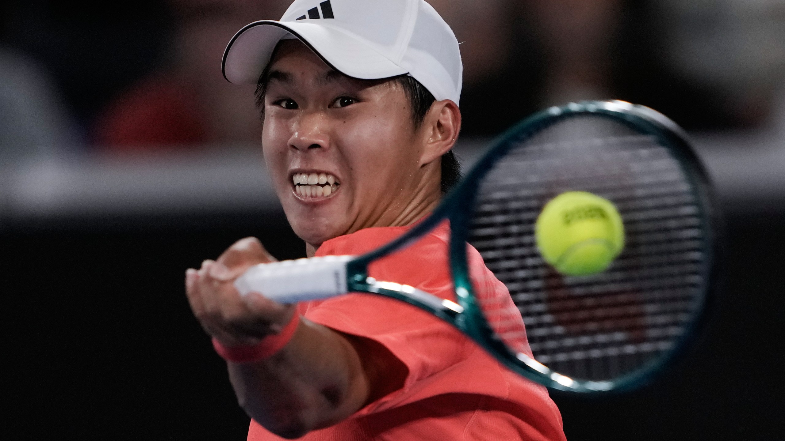 Learner Tien of the U.S. plays a forehand return to Daniil Medvedev of Russia during their second round match against at the Australian Open tennis championship in Melbourne, Australia, Thursday, Jan. 16, 2025. (AP Photo/Ng Han Guan)