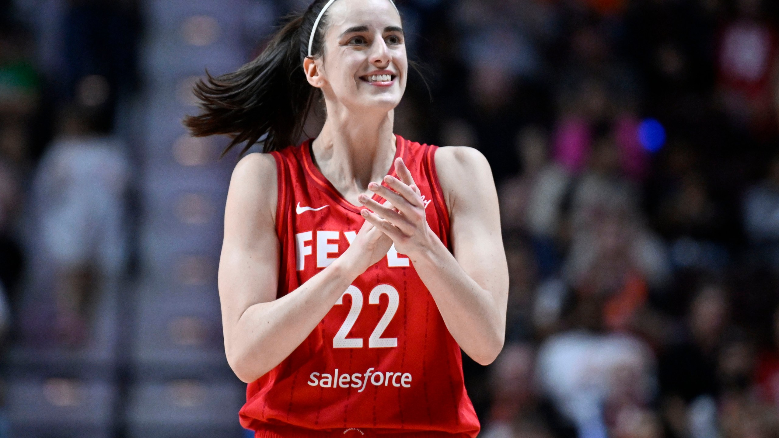 FILE - Indiana Fever guard Caitlin Clark (22) reacts during a first-round WNBA basketball playoff game against the Connecticut Sun, Wednesday, Sept. 25, 2024, in Uncasville, Conn. (AP Photo/Jessica Hill, File)