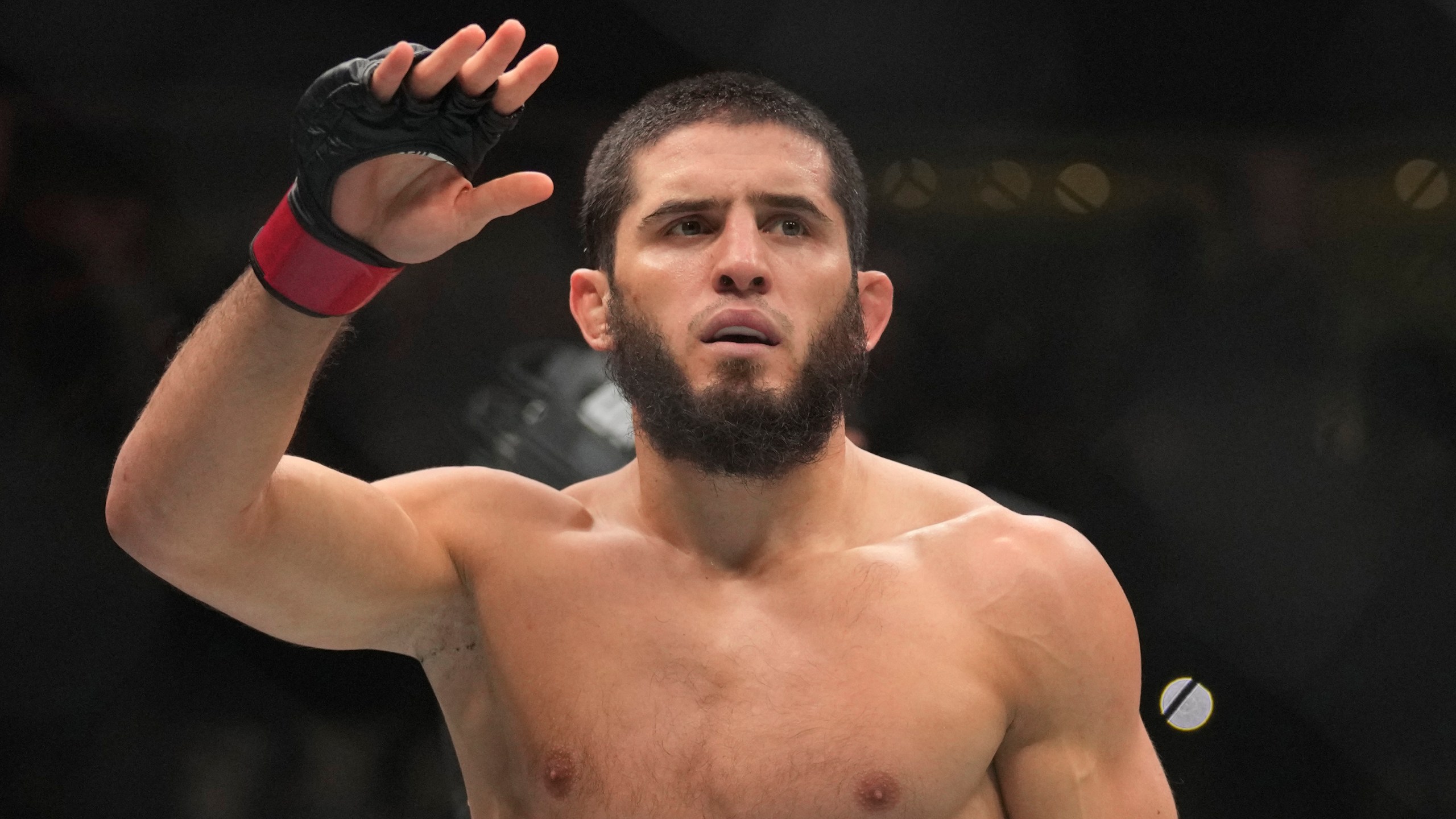 FILE - Islam Makhachev of Russia celebrates after he beats Alex Volkanovski of Australia in the UFC lightweight championship fight during UFC 294, at the Ethihad Arena in Abu Dhabi, United Arab Emirates, Oct. 21, 2023. (AP Photo/Kamran Jebreili, File)