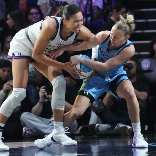 Mist's Courtney Vandersloot, right, and Lunar Owls' Napheesa Collier, left, go after the ball during the first half of the inaugural Unrivaled 3-on-3 basketball game, Friday, Jan. 17, 2025, in Medley, Fla. (AP Photo/Marta Lavandier)