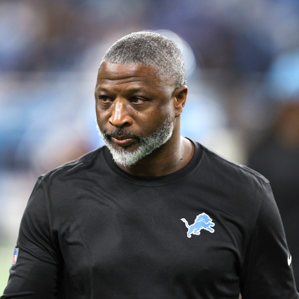 Detroit Lions defensive coordinator Aaron Glenn watches during warmups before an NFL football divisional playoff game against the Washington Commanders, Saturday, Jan. 18, 2025, in Detroit. (AP Photo/Mike Mulholland)