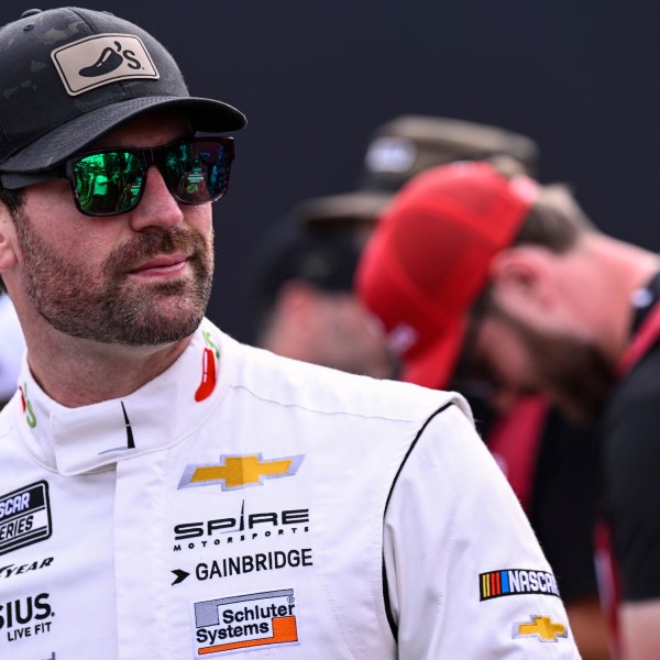 FILE - Driver Corey LaJoie looks on prior to a NASCAR Cup Series auto race at Charlotte Motor Speedway, May 26, 2024, in Concord, N.C. (AP Photo/Matt Kelley, file)