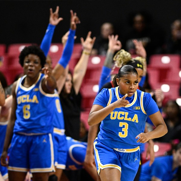 UCLA guard Londynn Jones (3) gestures after she made a 3-point basket during the second half of an NCAA college basketball game against Maryland, Sunday, Jan. 26, 2025, in College Park, Md. (AP Photo/Nick Wass)