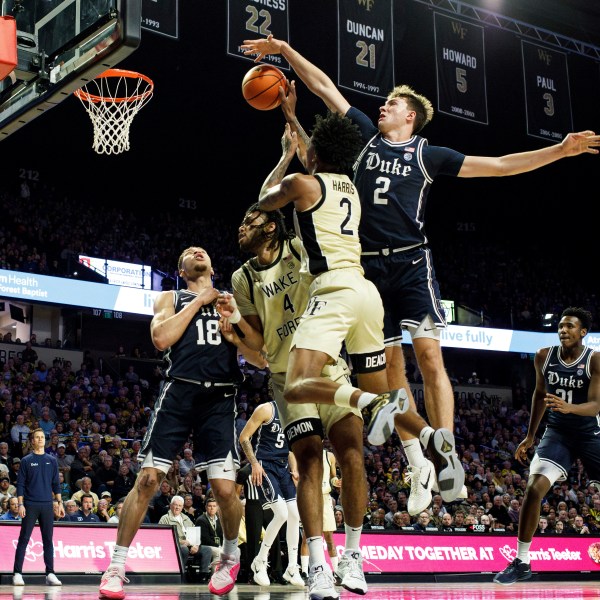 Duke's Cooper Flagg, right, blocks the shot of Wake Forest's Juke Harris, left, during the first half of an NCAA college basketball game in Winston-Salem, N.C., Saturday, Jan. 25, 2025. (AP Photo/Ben McKeown)