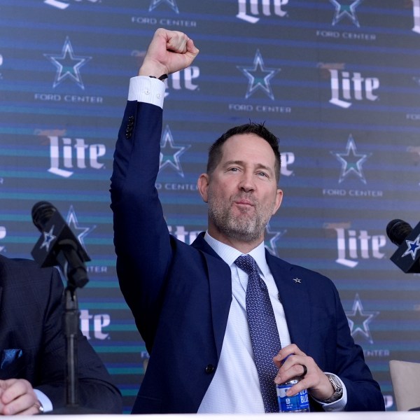 Stephen Jones, left, Dallas Cowboys Chief Operating Officer and Co-Owner looks on as the team's new head coach, Brian Schottenheimer recognizes someone in the audience during a news conference in Frisco, Texas, Monday, Jan. 27, 2025. (AP Photo/Tony Gutierrez)