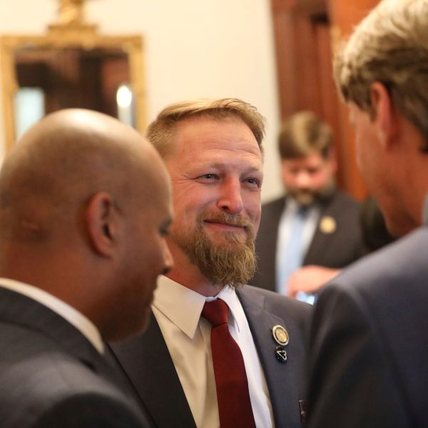 South Carolina Rep. Branon Guffey speaks to senators outside the House chamber in Columbia, South Carolina, Wednesday, May 2, 2023. Guffey’s 17-year-old son took his own life in July 2022 after a Nigerian man posed as a woman and then tried to extort the teen after he sent nude photos. (AP Photo/Jeffrey Collins)