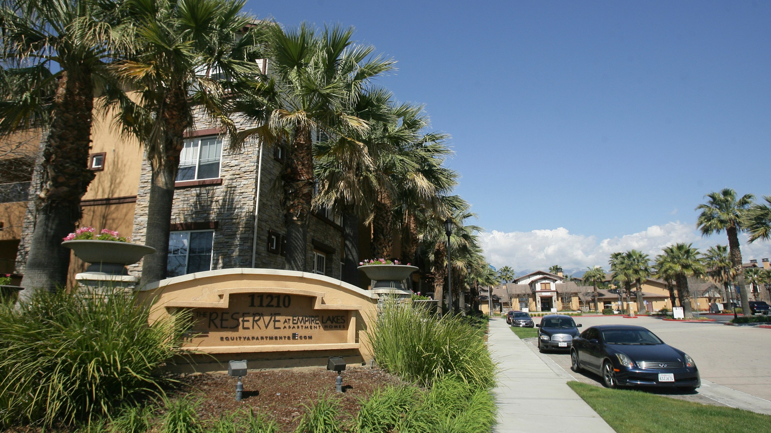 FILE - Federal agents raided about 20 locations, related to a birth tourism scheme, in three Southern California counties, including this apartment complex in Rancho Cucamonga, Calif., Tuesday, March 3, 2015. (Stan Lim/The Press-Enterprise via AP,File)