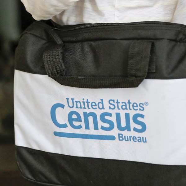 FILE - A briefcase of a census taker is seen as she knocks on the door of a residence, Aug. 11, 2020, in Winter Park, Fla. (AP Photo/John Raoux, File)